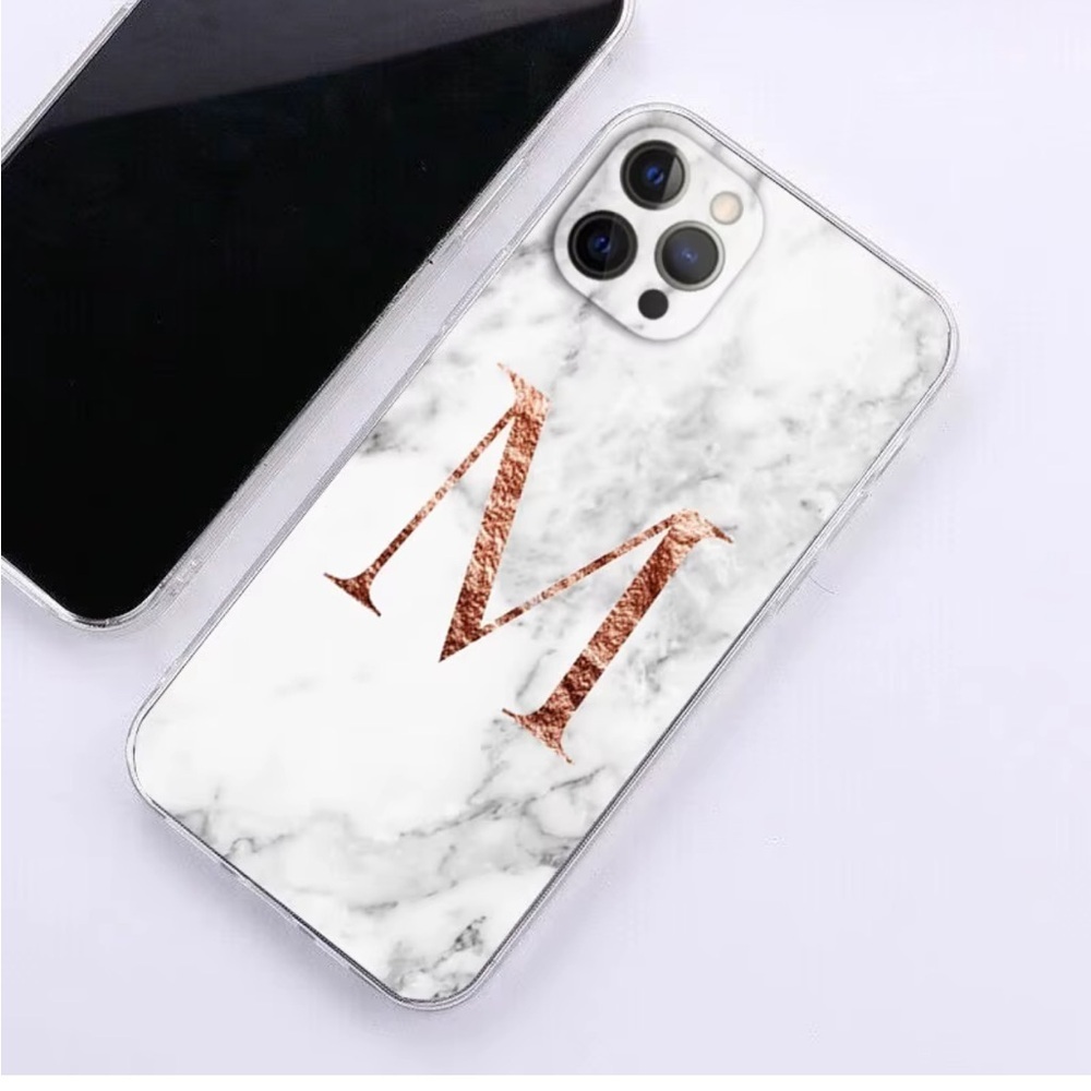 White marble pattern iPhone 13 Pro Max case with a large Rose Gold Letter M